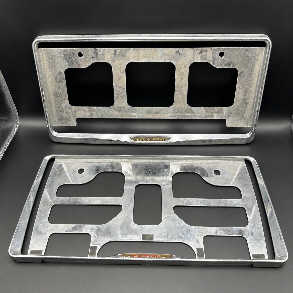 Damaged License Plate Frame Surrounds